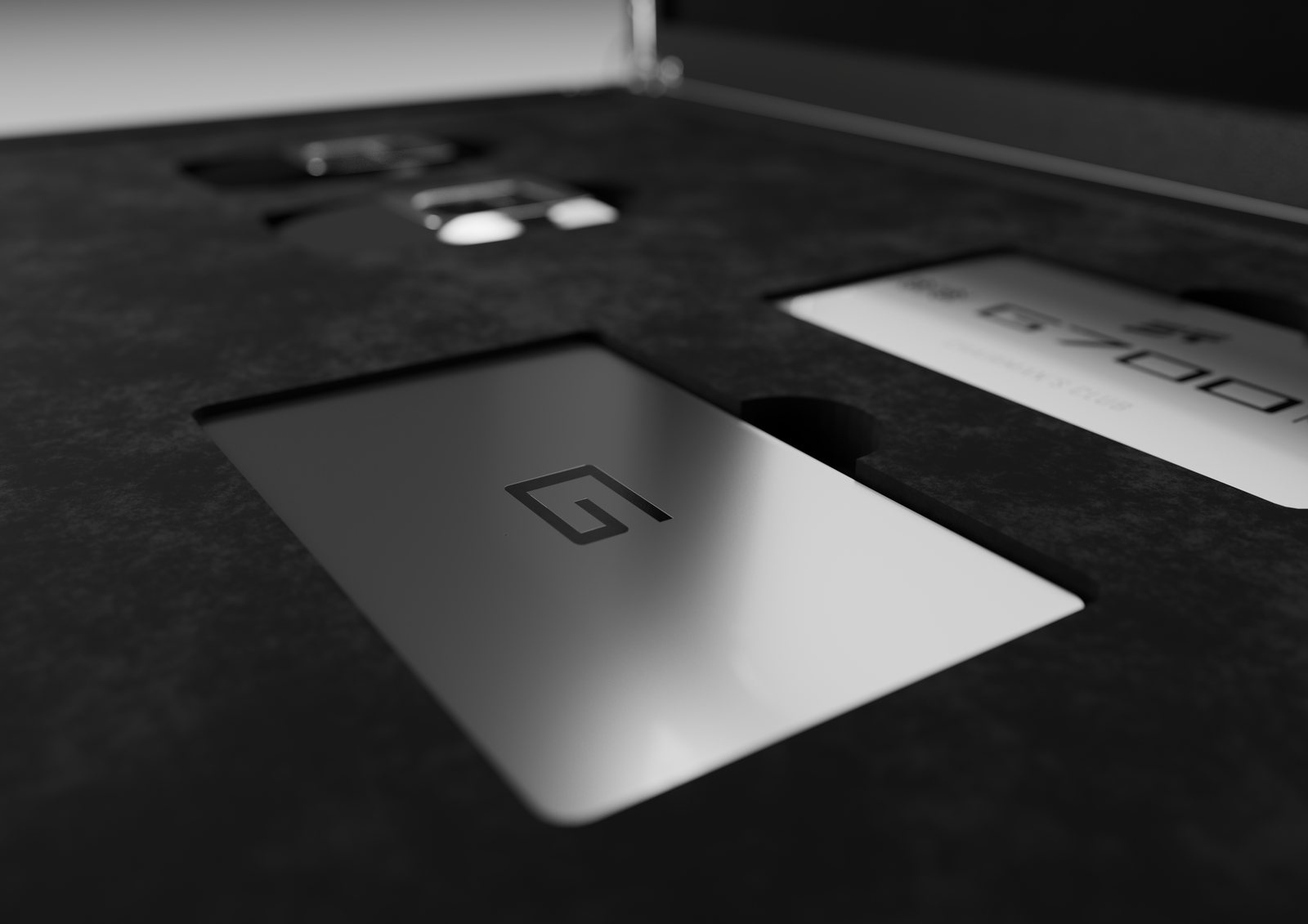 Close-up of certificate and card compartments inside the box