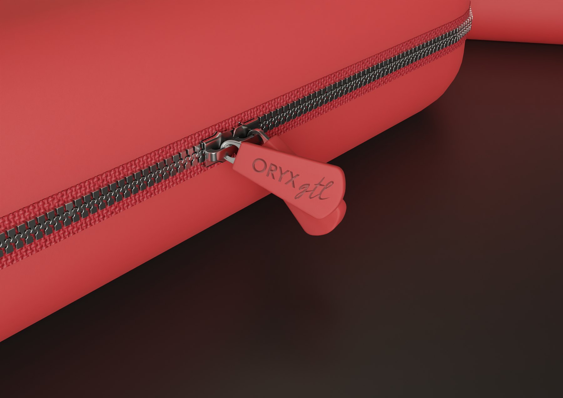 Close-up of the Oryx GTL pouch zipper pull and red pouch material